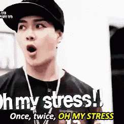 a man wearing a hat and a necklace is saying oh my stress .
