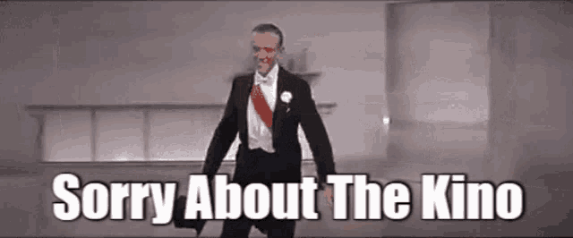 a man in a tuxedo and bow tie is saying " sorry about the kino "