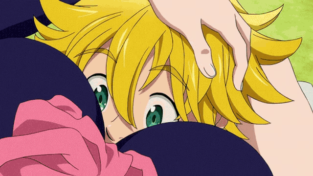 a close up of a person 's face with yellow hair