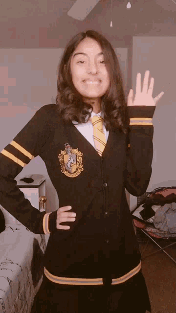 a girl in a harry potter costume is smiling