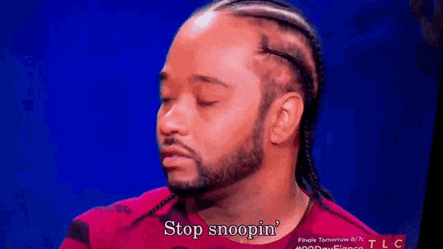a man with dreadlocks and a beard says stop snoopin '
