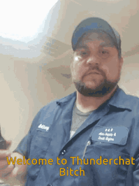 a man in a blue shirt and hat says welcome to thunderchat