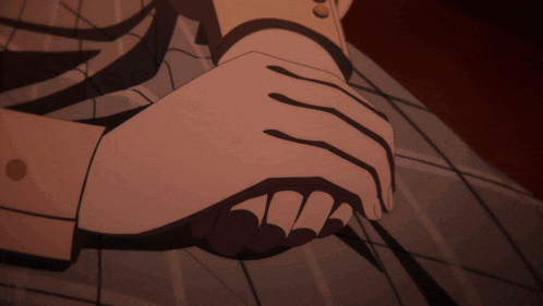 a close up of a person 's hands holding a sword