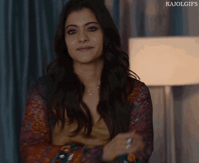 a close up of a woman with the words kajol gifs on the bottom