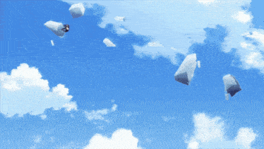 a blue sky with white clouds and a few pieces of paper floating in it