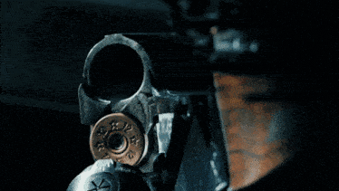 a poster for brats boom corner with a shotgun