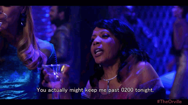 a woman is holding a martini and says " you actually might keep me past 0200 tonight "
