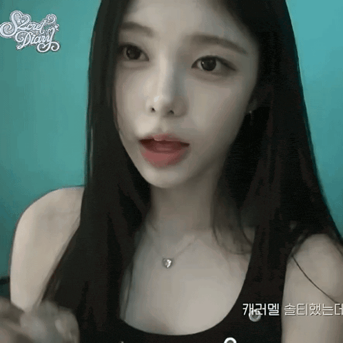 a woman wearing a black tank top with the word secret diary on the top