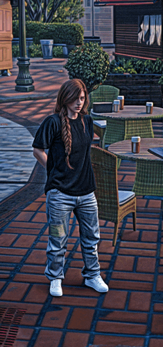 a woman in a black shirt and jeans is standing in front of tables