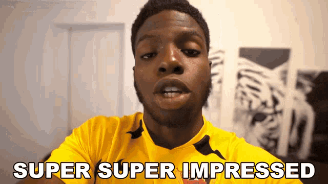 a man wearing a yellow shirt with the words super super impressed on it