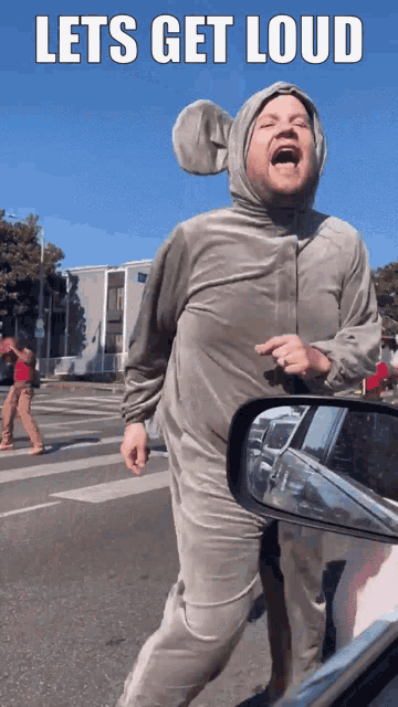 a man in an elephant costume with the words lets get loud written above him