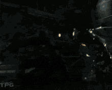 a pixelated image of a person with wings and the letters tpg on the bottom right
