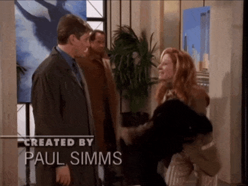 a man and a woman are standing next to each other with the caption created by paul simms