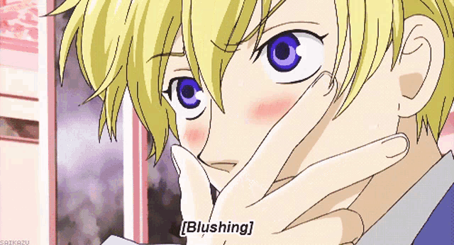 a close up of a person 's face with blushing written on the bottom right