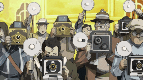 a group of people are holding up cameras and flashes in front of them