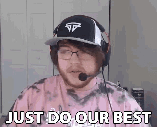 a man wearing a hat and headphones is saying just do our best