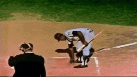 a baseball player with the letter c on the back of his shirt