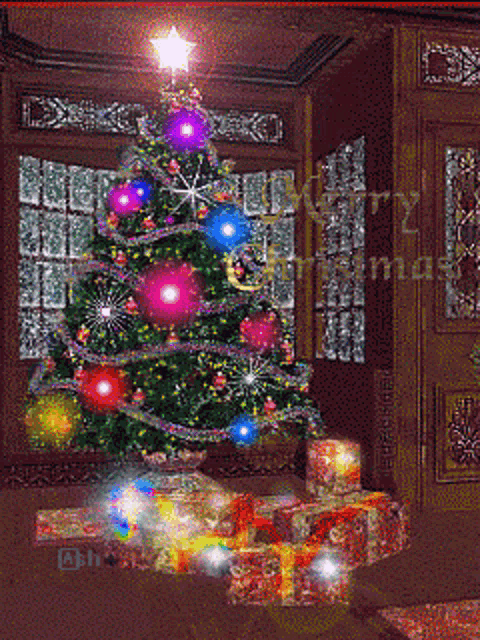 a christmas tree in a room with the words merry christmas on it