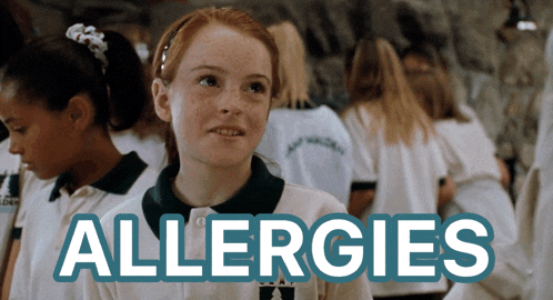 a girl with red hair is standing in front of a sign that says " allergies "