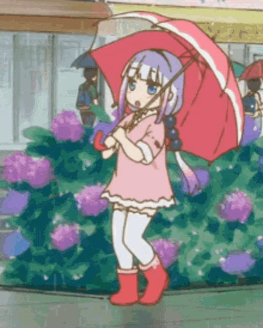 a girl in a pink dress and red boots is holding an umbrella in the rain .