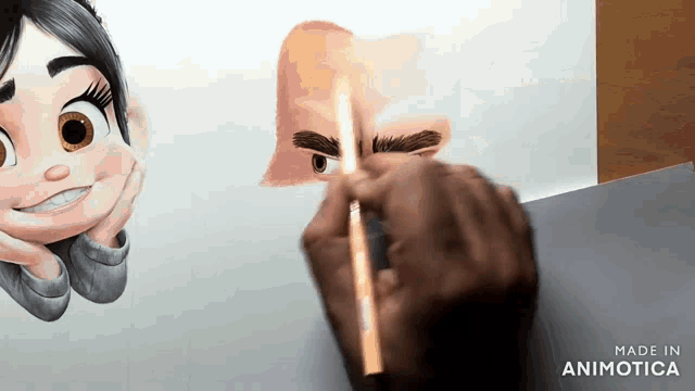 a person is drawing a cartoon character 's face with a pencil .