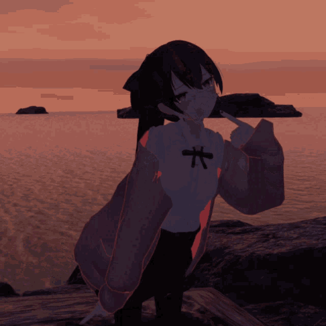 a girl with a bow on her shirt is standing on a rock near the ocean