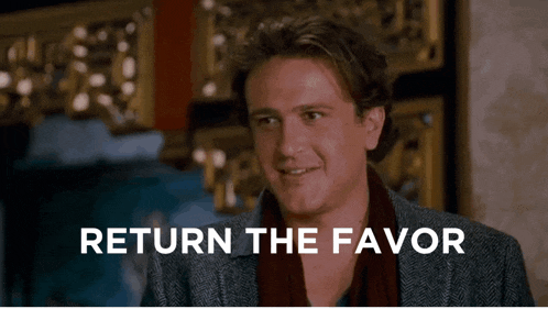 a man says return the favor in front of a wall