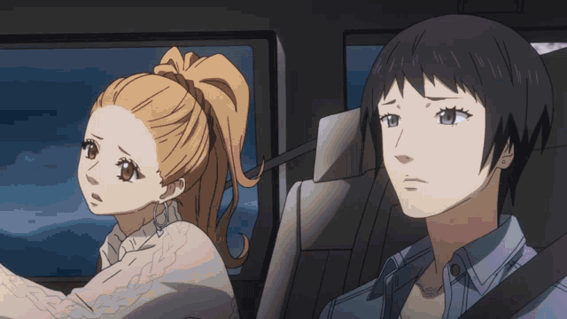 a man and a woman are sitting in a car with their eyes closed