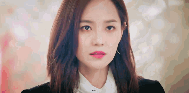 a close up of a woman 's face with the word dear on the bottom right