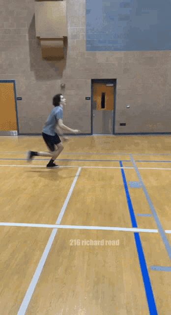 a man is playing basketball on a court with the name 216 richard visible in the corner