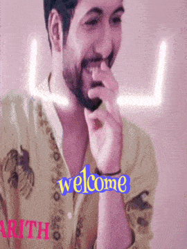 a man with a beard is smiling and the word welcome is on the bottom