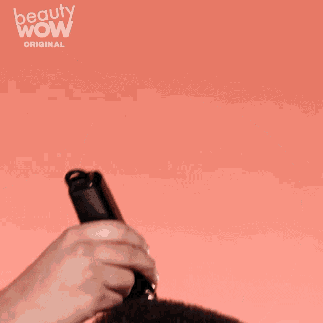 a man 's hair is being combed by a beauty wow original