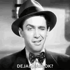 a man wearing a hat and bow tie is making a funny face and asking , `` dejalo asi ok ? ''