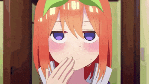 a close up of a girl with orange hair and purple eyes covering her mouth with her hand .