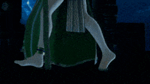 a woman in a green dress and white tights stands in front of a blue sky