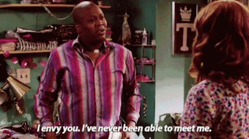 a man in a striped shirt says i envy you