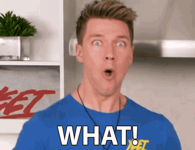 a man is wearing a blue shirt that says what