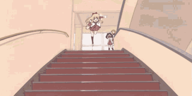 a girl is laying on a set of red stairs