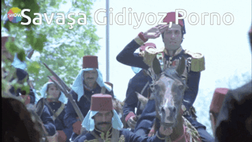 a group of men riding horses with the words " savaşa gidiyoz porno " written above them