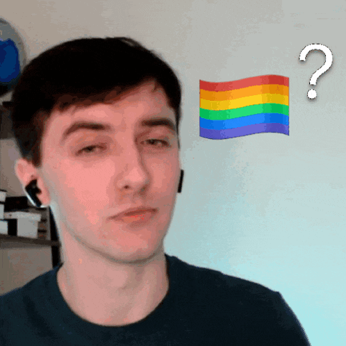 a man with a rainbow flag and a question mark