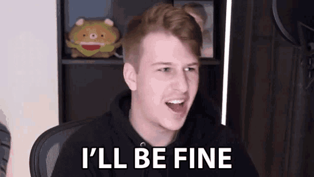 a young man is sitting in a chair with his mouth open and says `` i 'll be fine ''