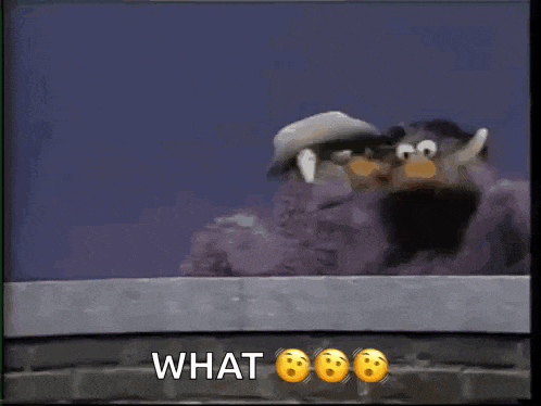 a couple of stuffed penguins are standing next to each other with the words what written below them