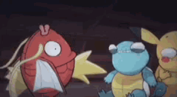 a group of pokemon are standing next to each other .