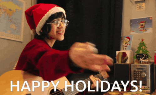 a woman in a santa hat is playing a guitar with the words happy holidays behind her