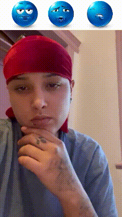 a woman wearing a red headband has three blue smiley faces on her face