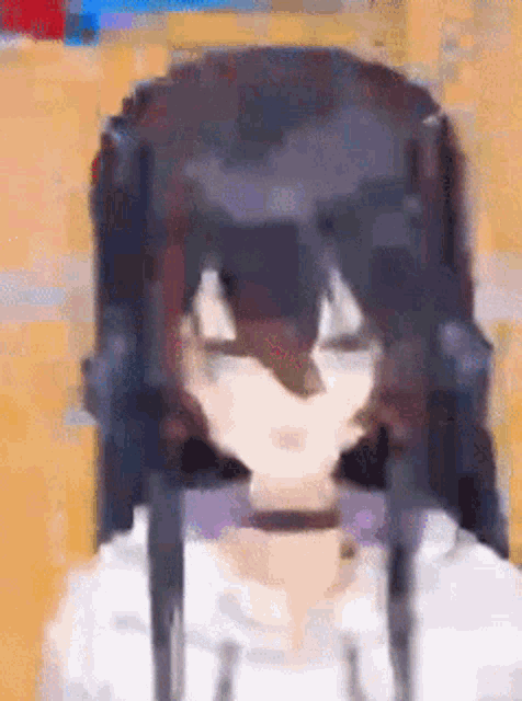 a pixel art drawing of a girl with long black hair and headphones .