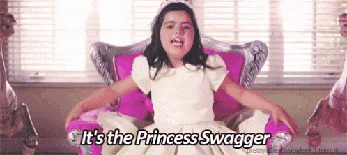 a little girl in a princess dress is sitting in a pink chair with the words it 's the princess swagger below her
