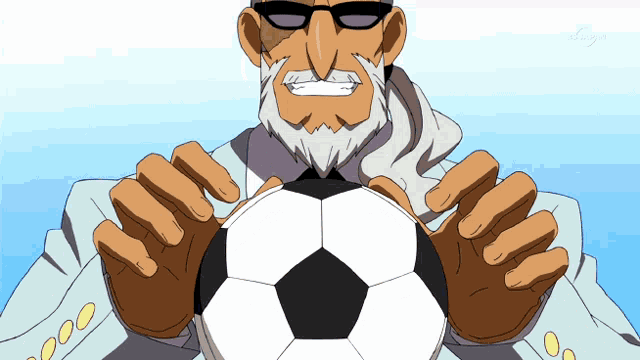 a man with a beard and sunglasses holds a soccer ball in his hands