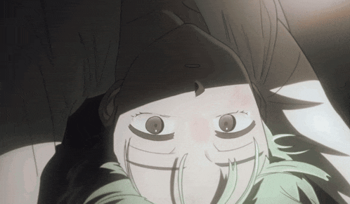 a close up of a person with green hair