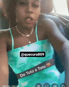 a woman in a blue tank top with the words de toto a toto on the bottom
